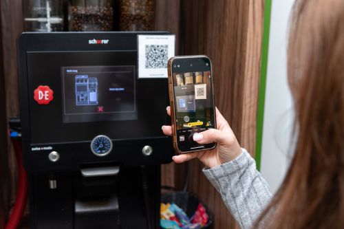 scan qr om defect koffiemachine te melden